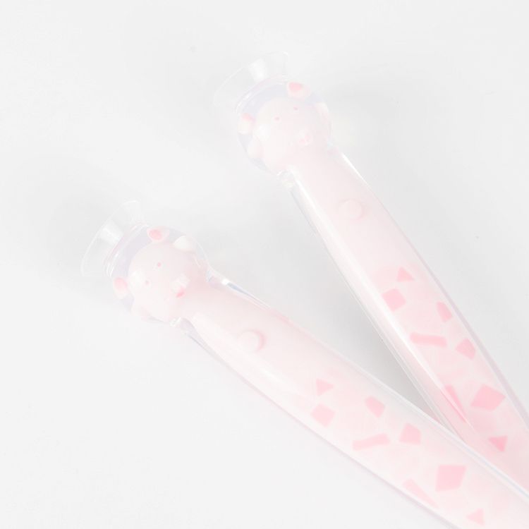 Set of white and pink spoons