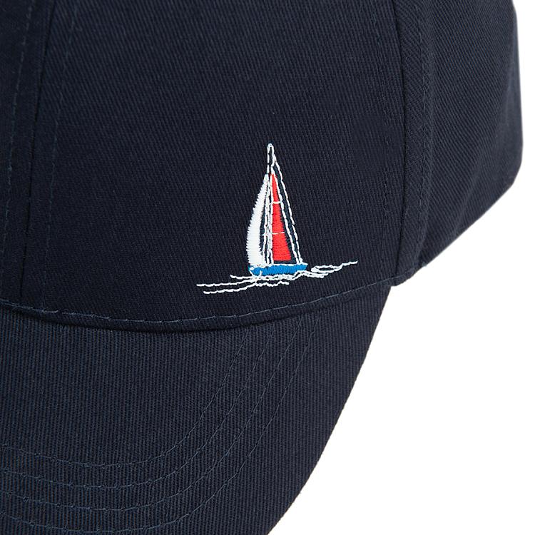 Dark blue jockey hat with small sailing boat print