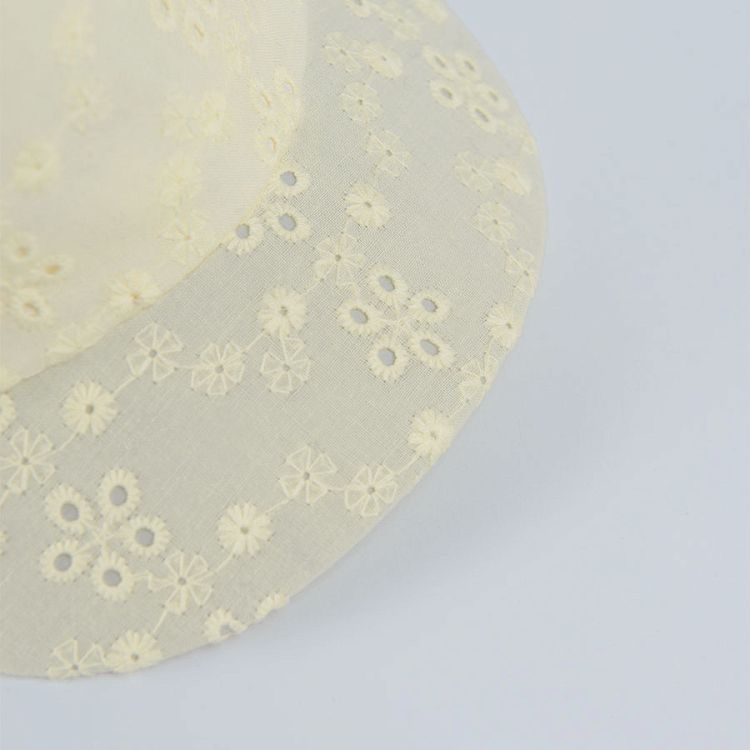 Yellow jockey hcap with flower print and bow on the elastic band