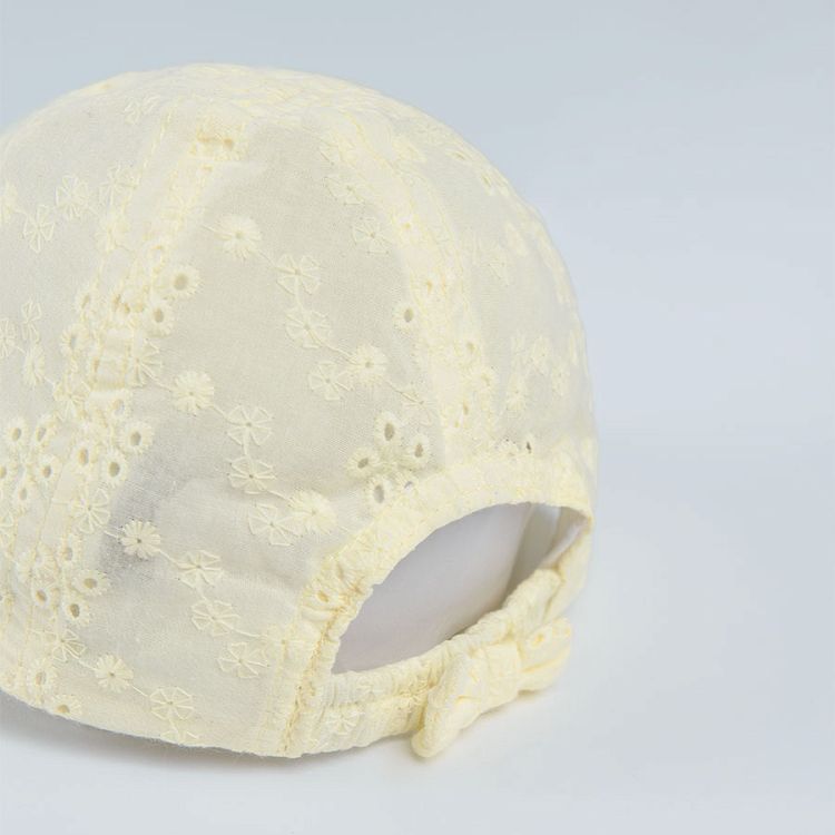 Yellow jockey hcap with flower print and bow on the elastic band
