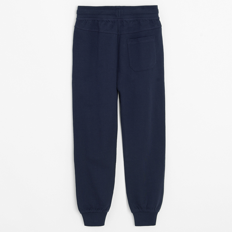 Dark blue sweatpants with elastic ankles and cord