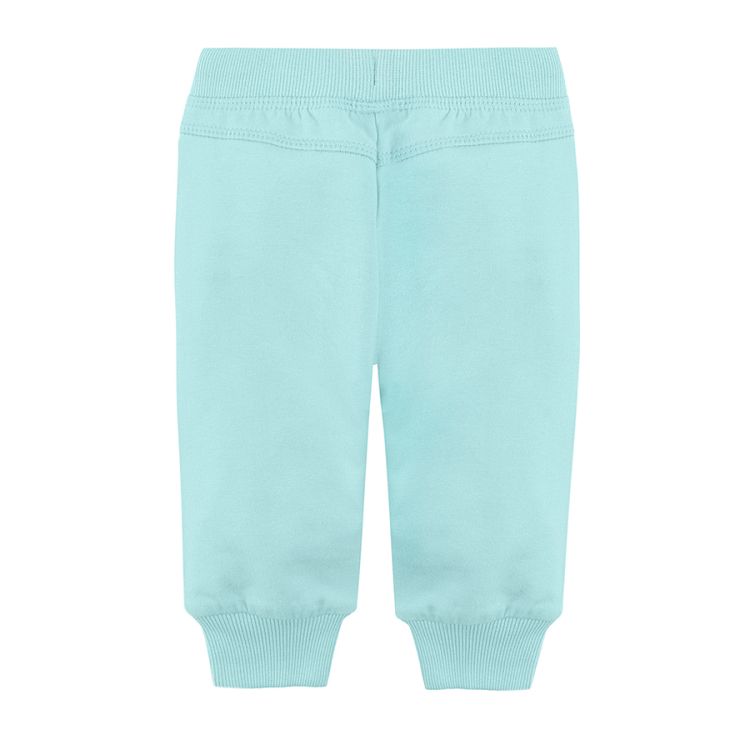 Light blue jogging pants with cord and elastic waist