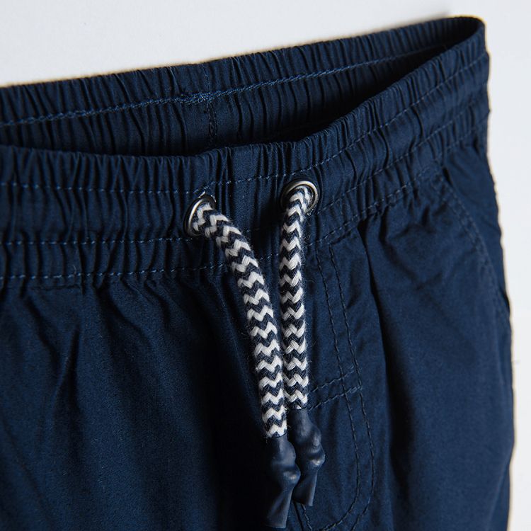 Trousers with cord and pockets