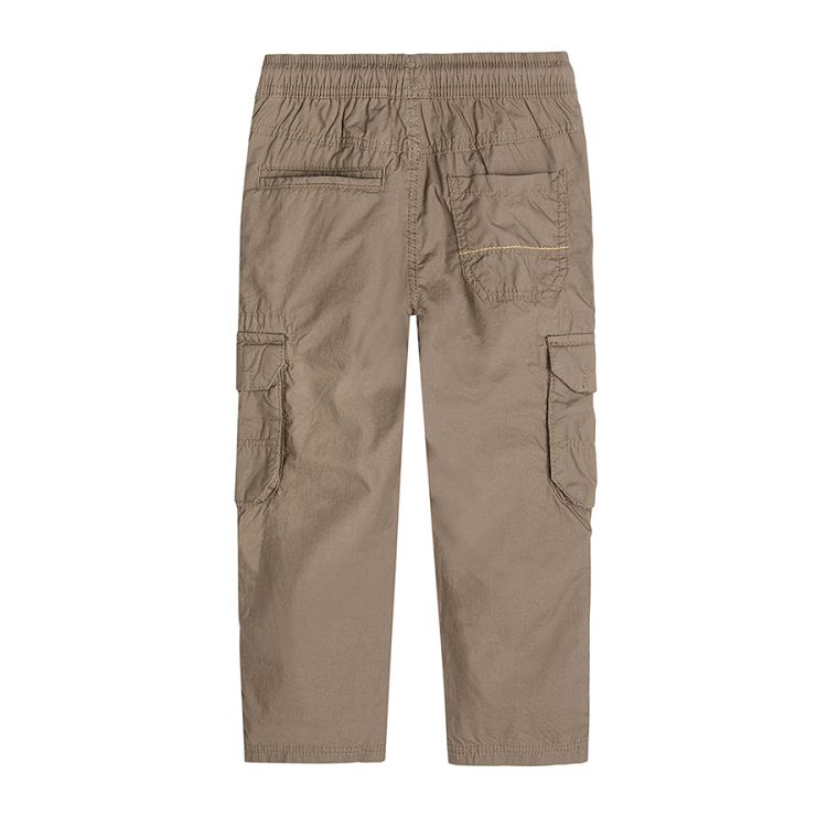 Brown trousers with external pockets