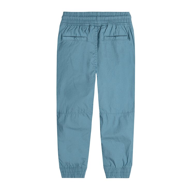 Trousers with cord and elastic band around the ankles