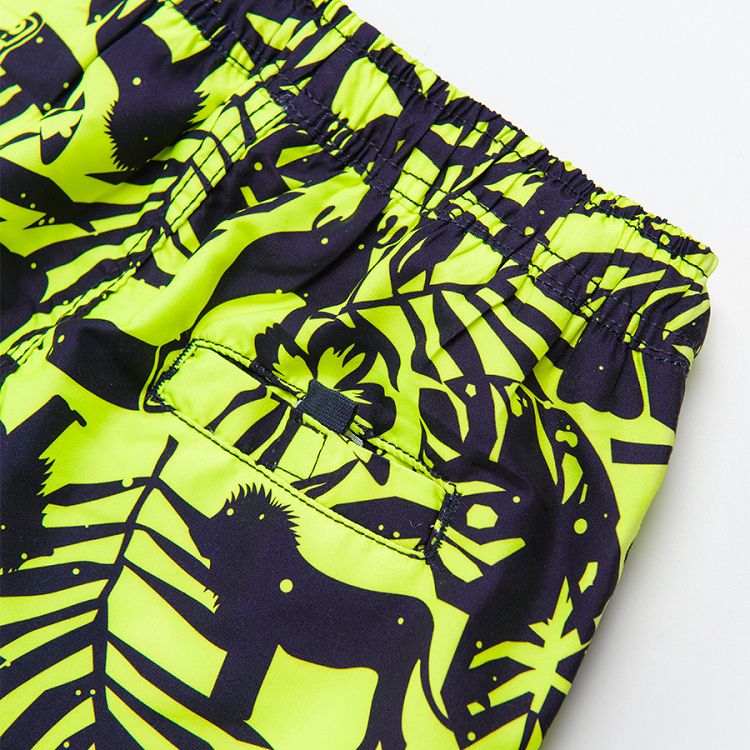 Swimming shorts with tropical leaves print