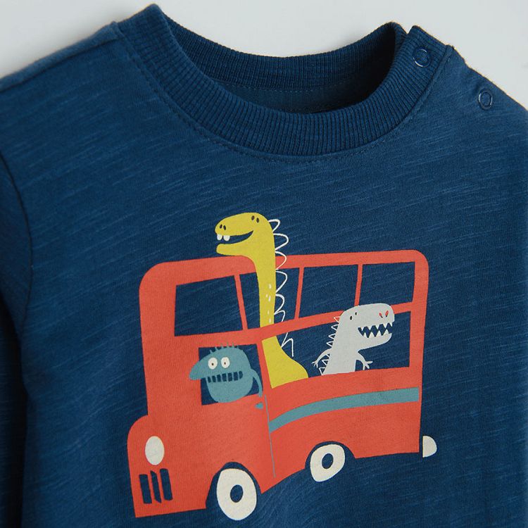 Blue long sleeve blouse with a bus with dinosaurs print