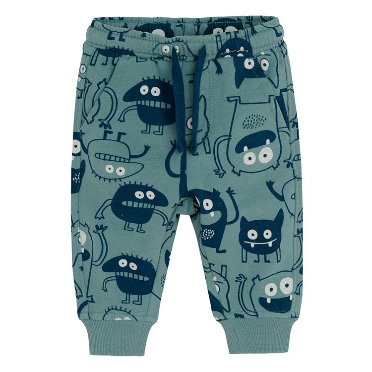 Light blue jogging pants with monsters print