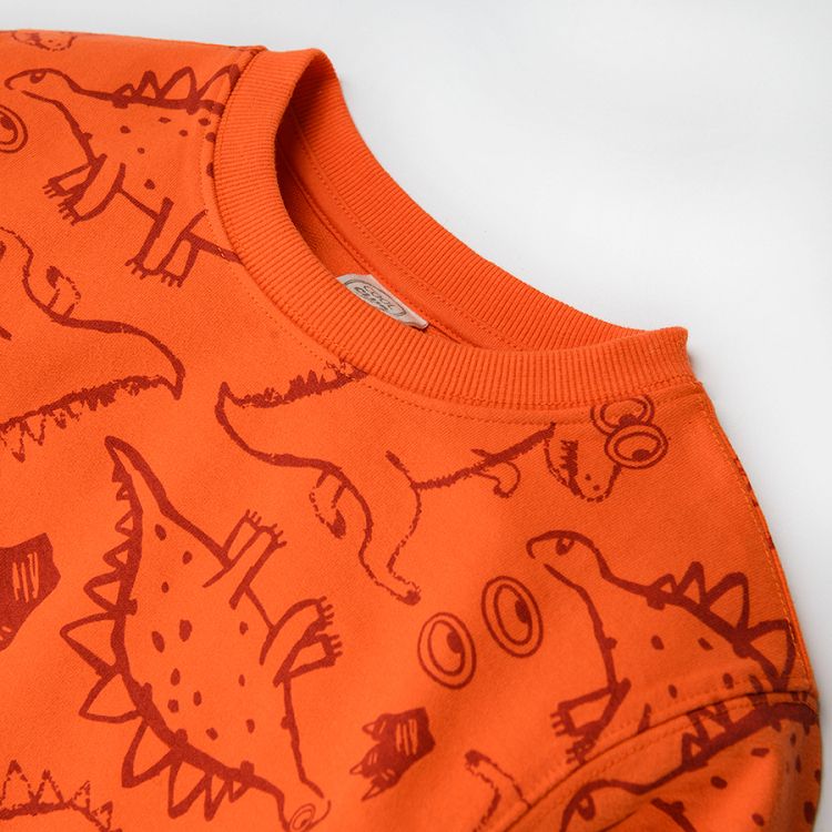 Orange sweatshirt with dinosaurs print