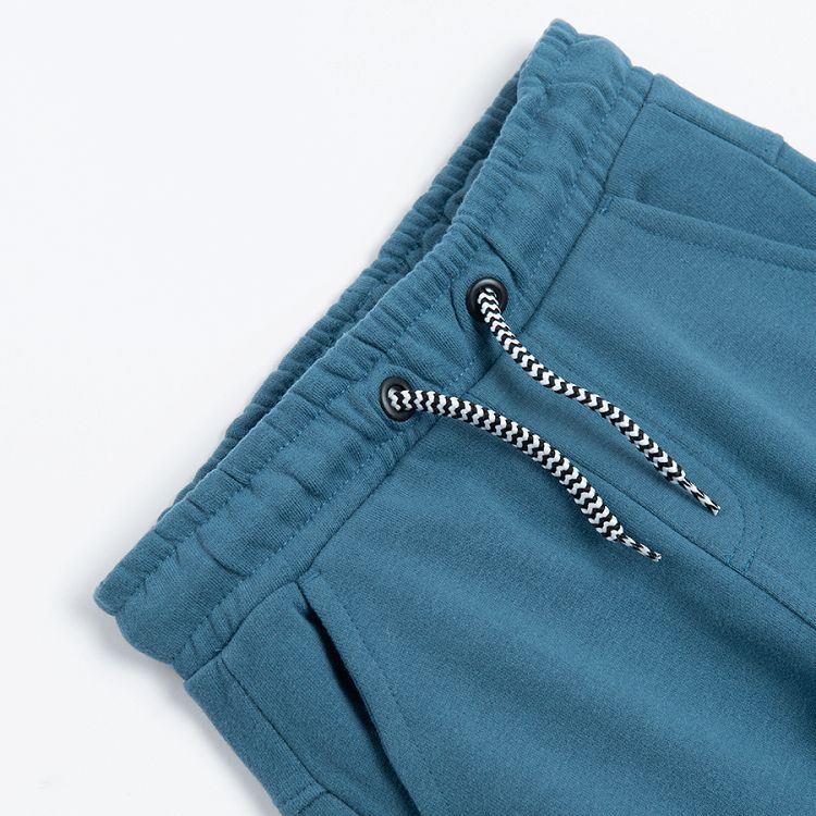 Turquoise monster jogging pants