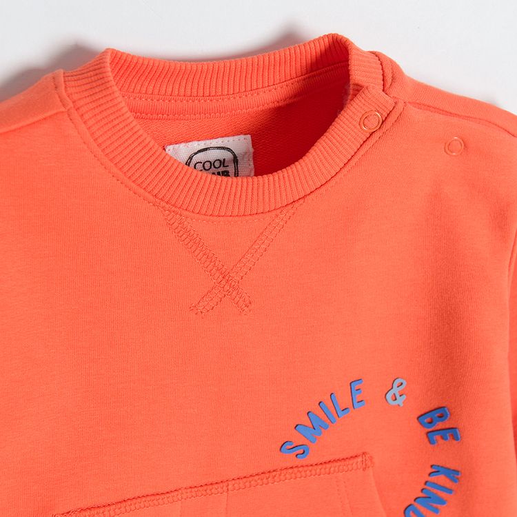 Orange sweatshirt with pockets on the front