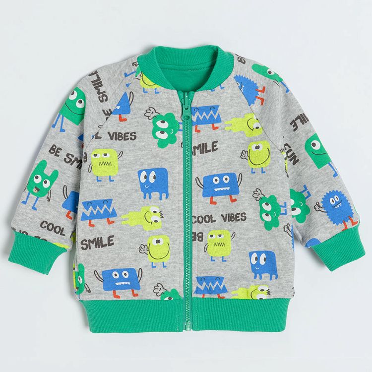 Green zip through hooded sweatshirt with animals print on the inside lining