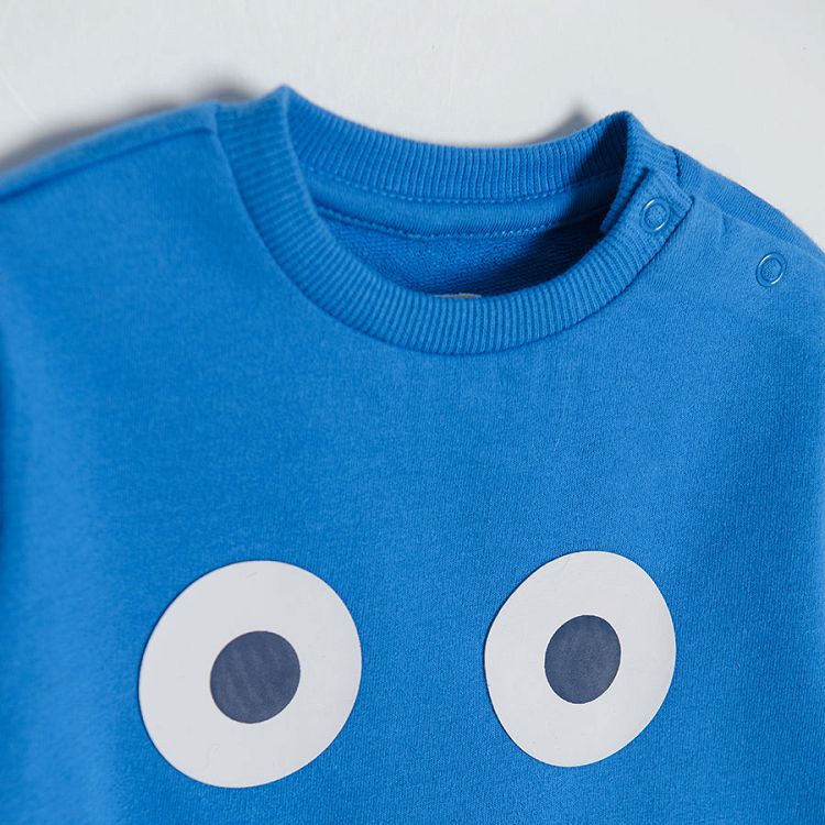 Blue sweatshirt with happy face