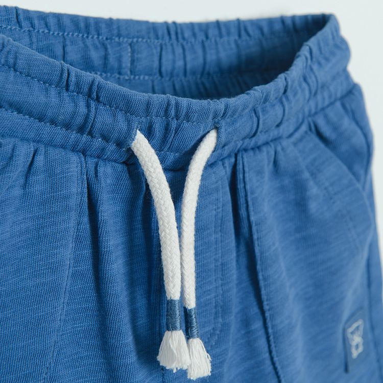Blue shorts with adjustable waist and side pockets