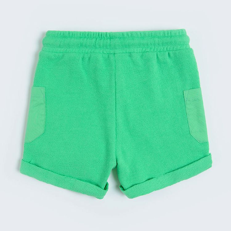 Green pants with adjustable waist and pockets