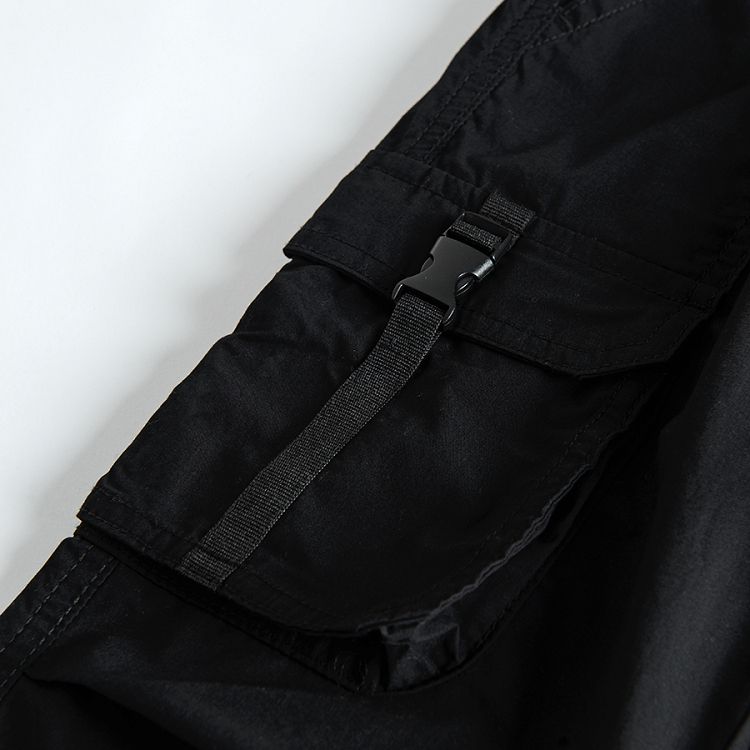 Black trousers with external pockets decorative clip and adjustable waist