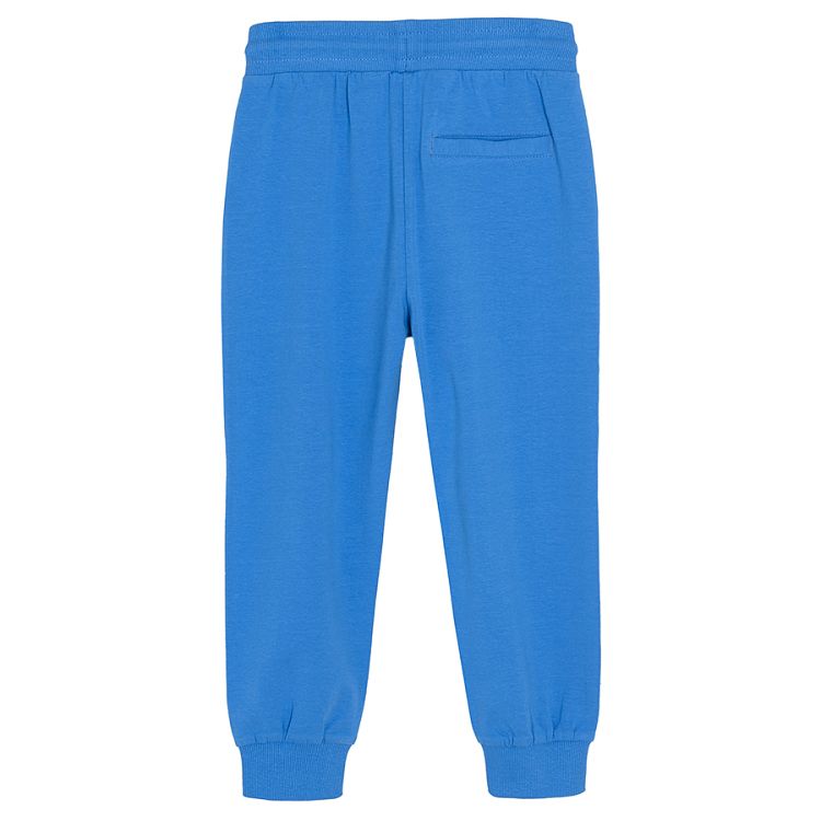 Navy blue jogging pants with adjustable waist and elastic band around the ankles