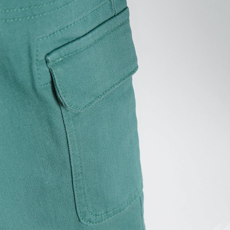 Blue trousers with adjustable waist and side pockets