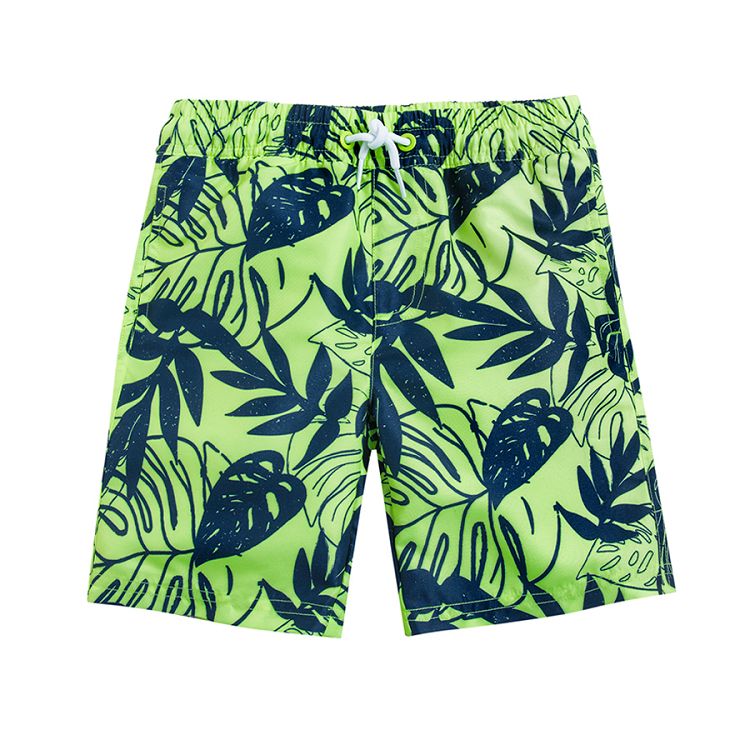 Turquoise swimming shorts with tropical leaves print