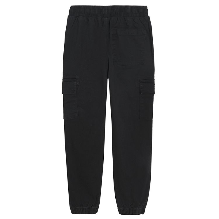 Black trousers with external side pockets and adjustable waist