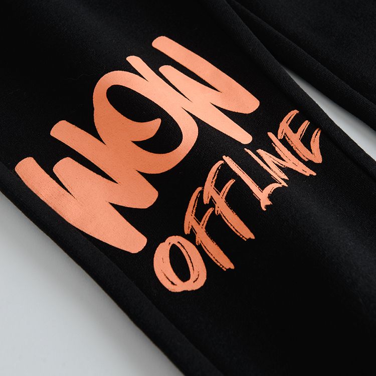 Black jogging pants with print on one knee
