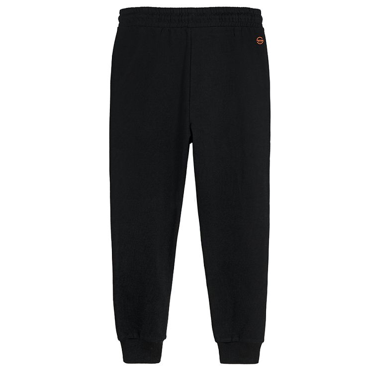 Black jogging pants with print on one knee