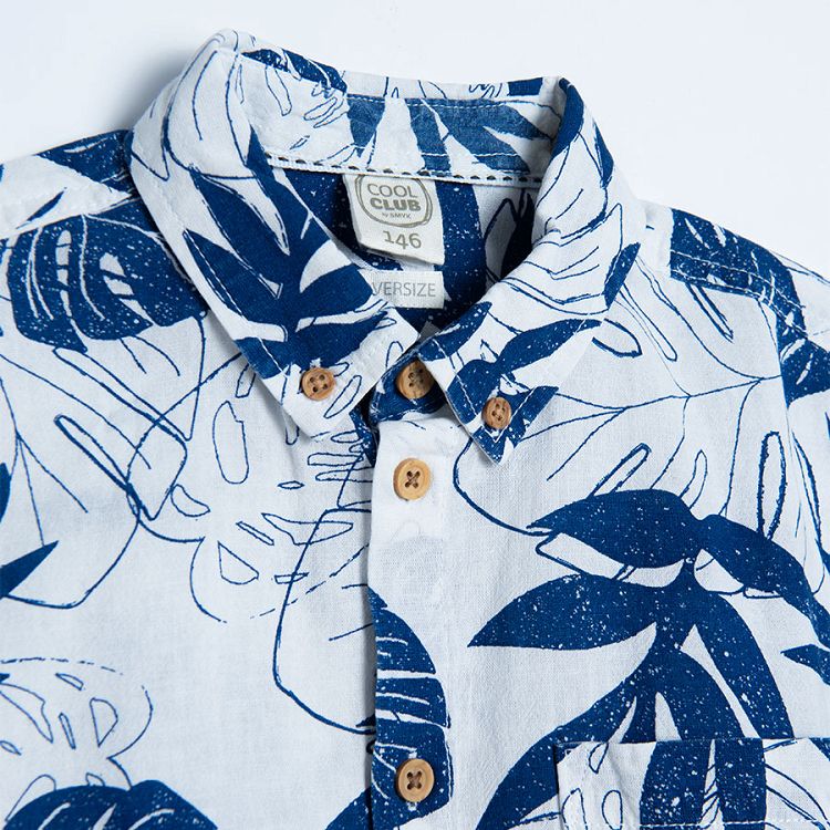 White short sleeve shirt with blue tropical leaves print and chest pocket