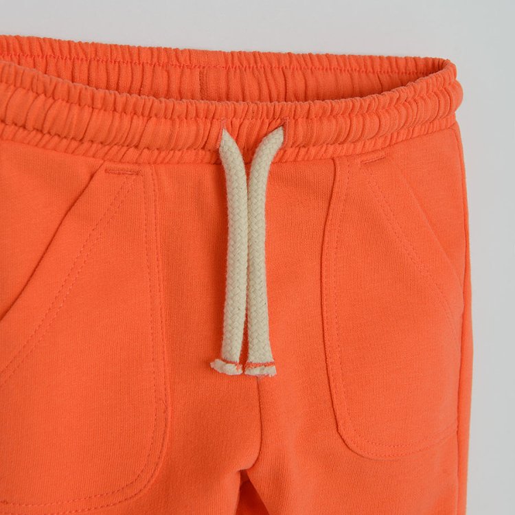 Orange jogging pants