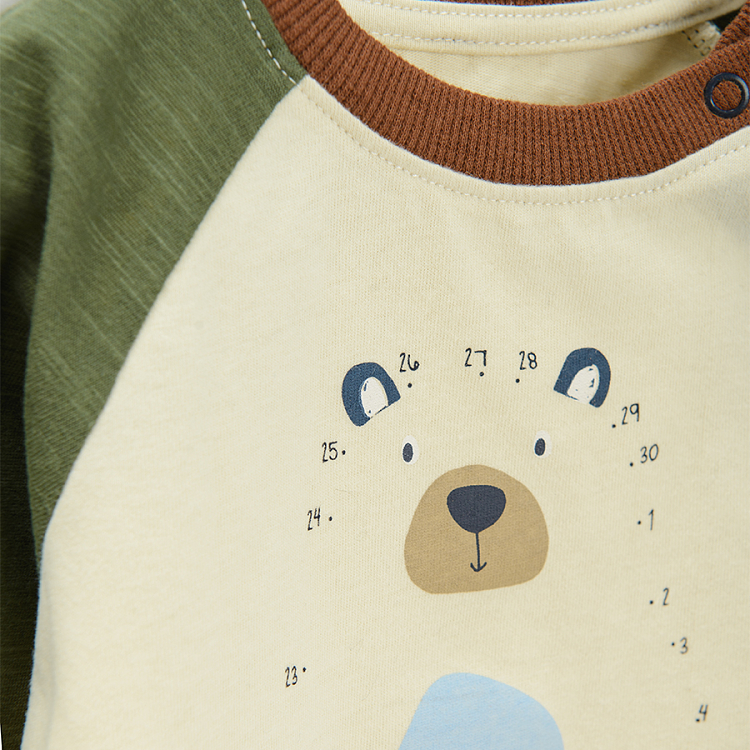 Beige long sleeve blouse with green sleeves and bear print