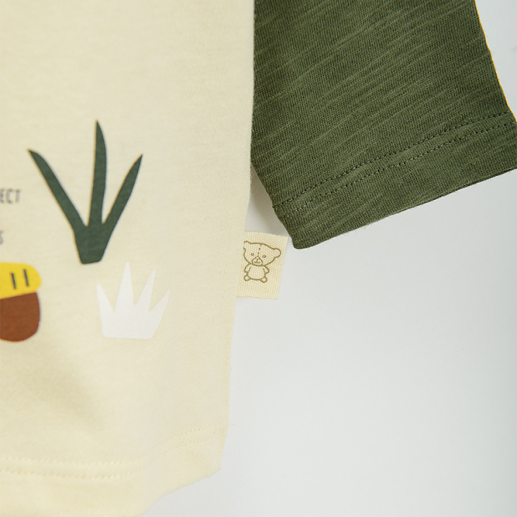 Beige long sleeve blouse with green sleeves and bear print