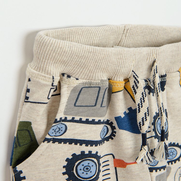 Ecru jogging pants with trucks print
