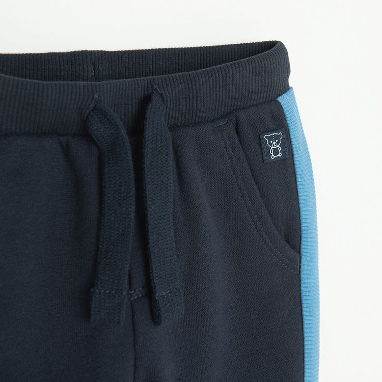 Blue grey jogging pants with blue stripe on the side
