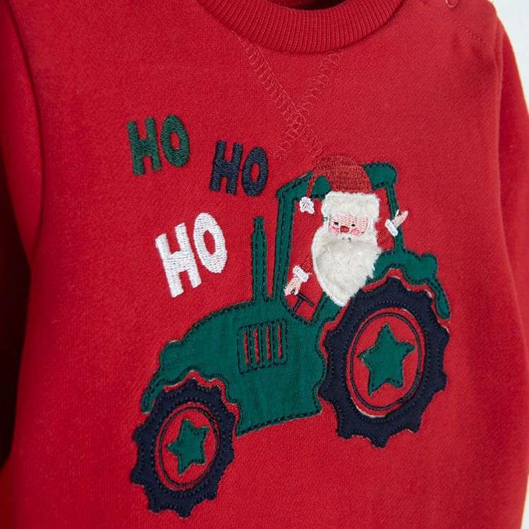 Red sweatshirt with Santa Claus on a truck print