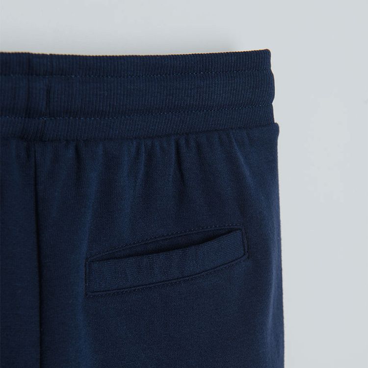Navy blue jogging pants with side pockets and adjustable waist