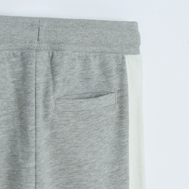 Grey jogging pants with white stripe on the side