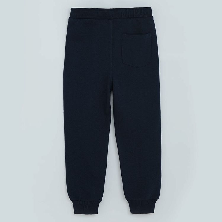 Blue jogging pants with elastic waist and truck print on the knee