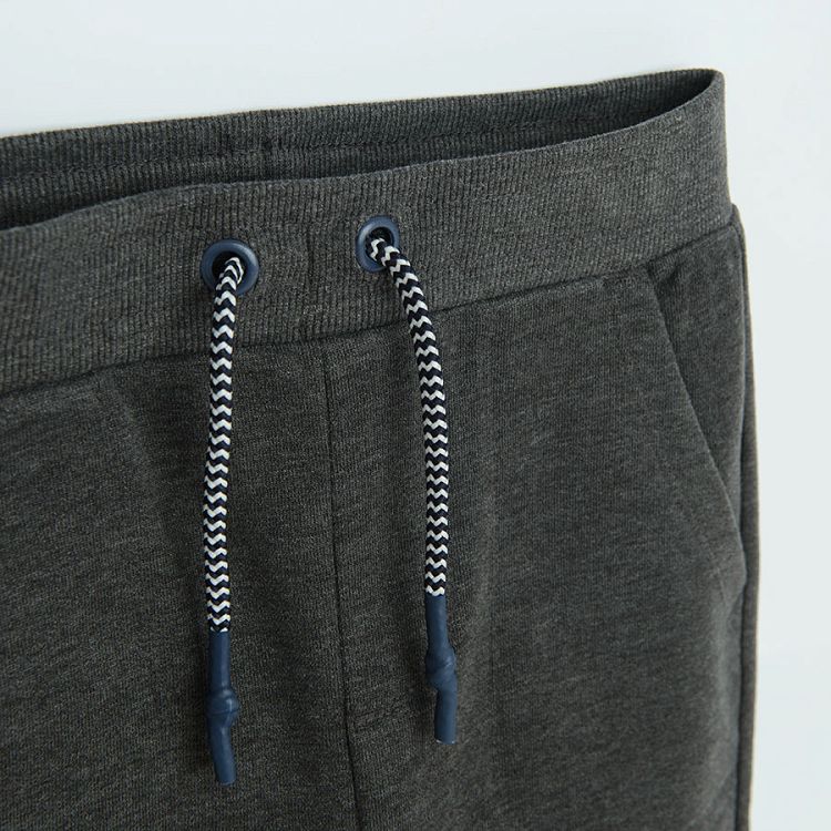 Grey jogging pants with cord on the waist