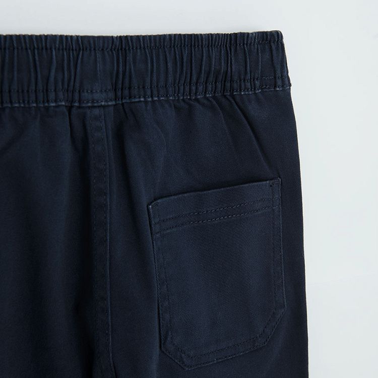 Dark blue trousers with cord on the waist