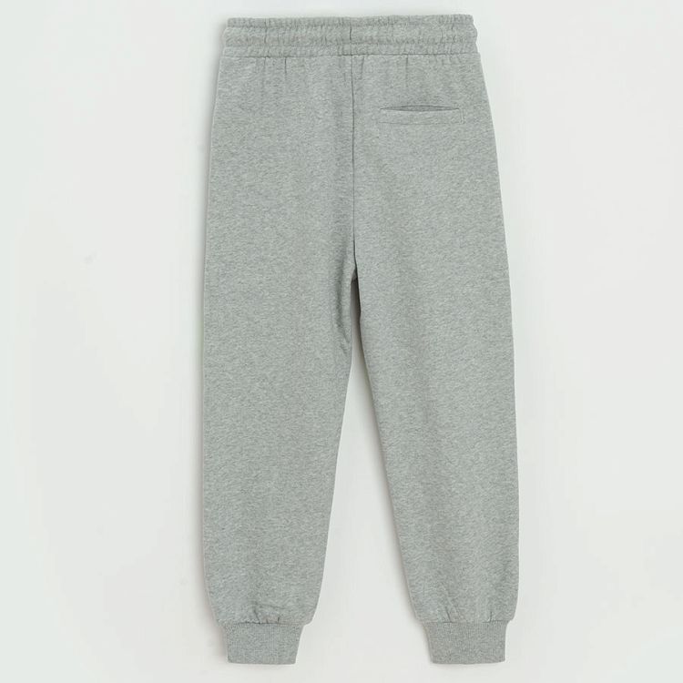 Grey jogging pants with blue and green stripes