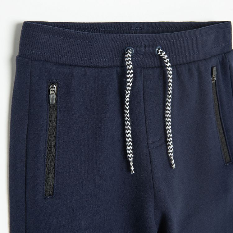 Blue jogging pants with cord on the waist