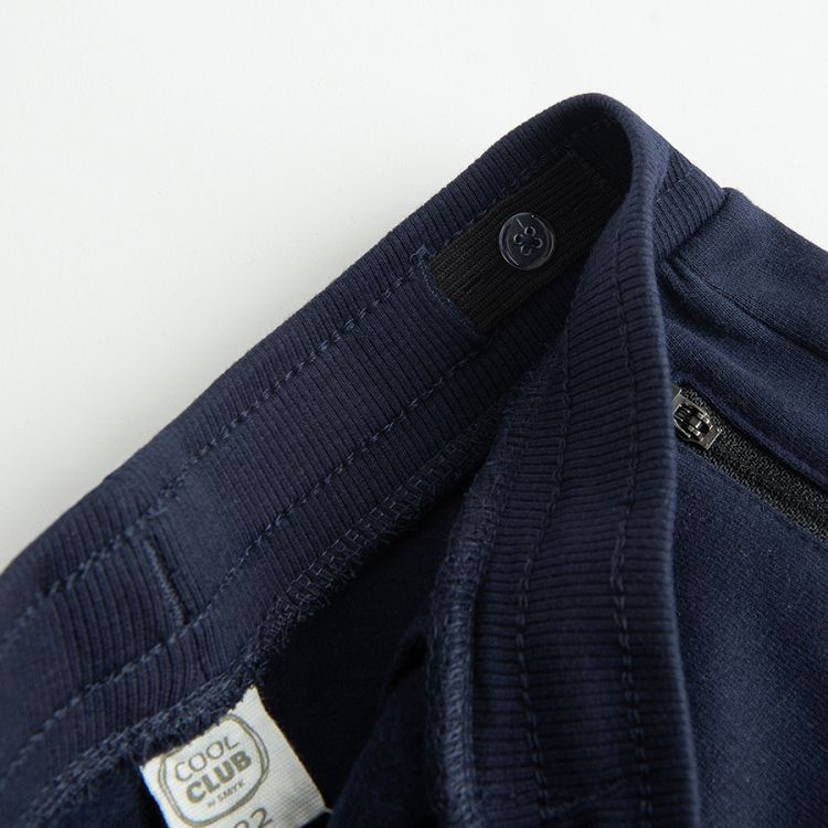 Blue jogging pants with cord on the waist