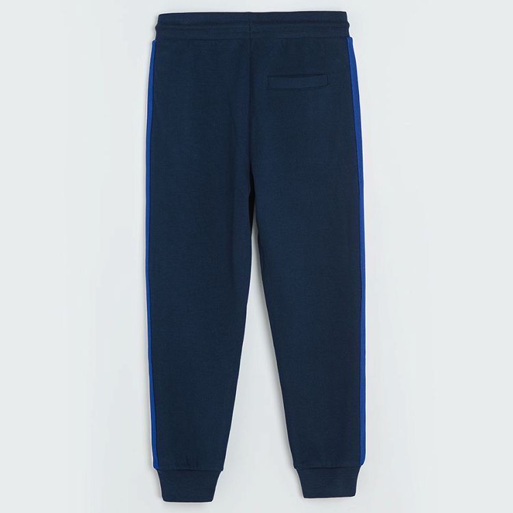 Dark blue jogging pants with yellow, white and blue stripe on the side