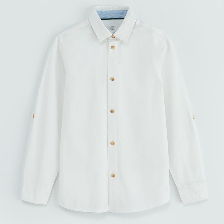 White long sleeve shirt with sleeve rolling up to a button