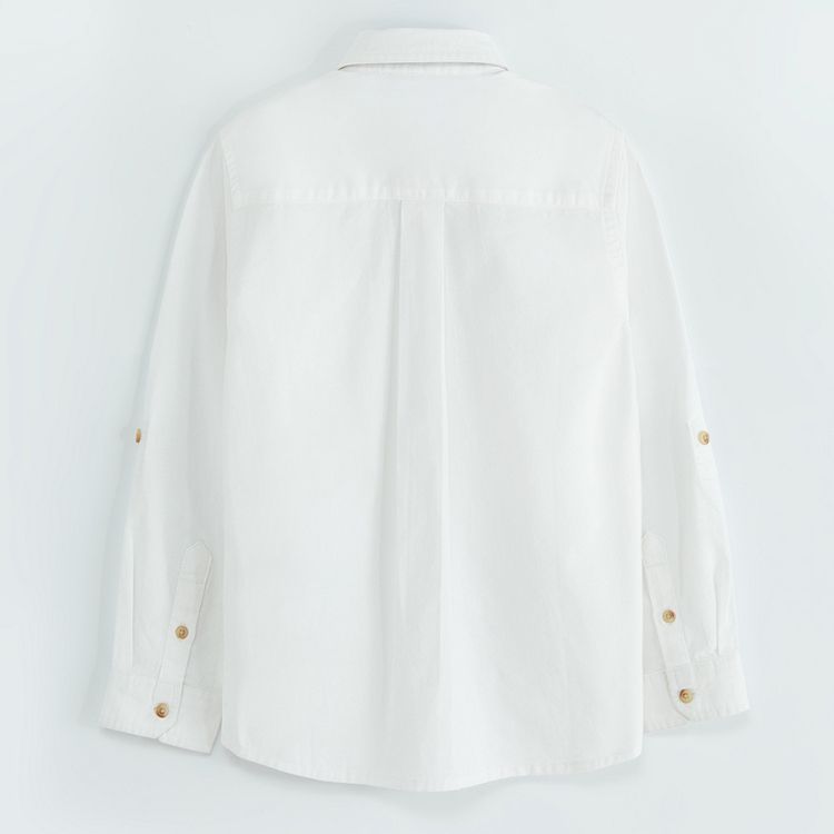 White long sleeve shirt with sleeve rolling up to a button