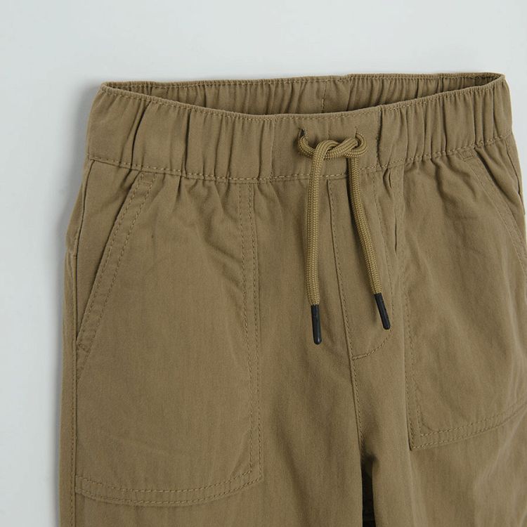 Brown trousers with side pockets