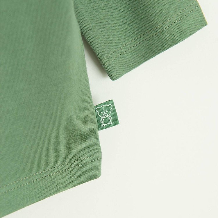 Green long sleeve blouse with funny face print