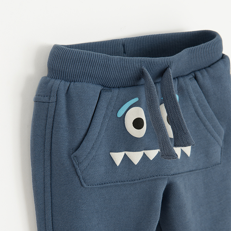 Blue grey jogging pants with funny face print