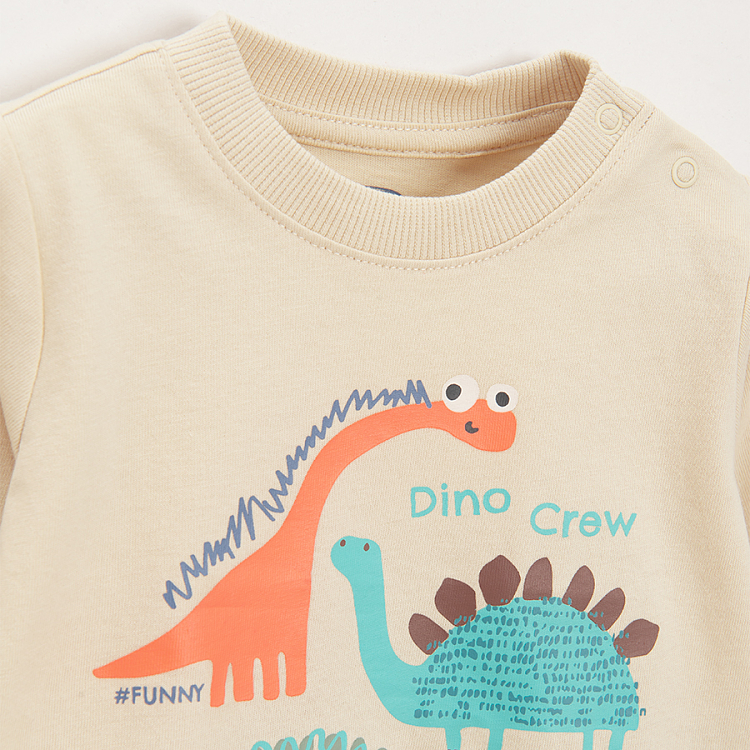 Ecru long sleeve blouse with dinosaurs print