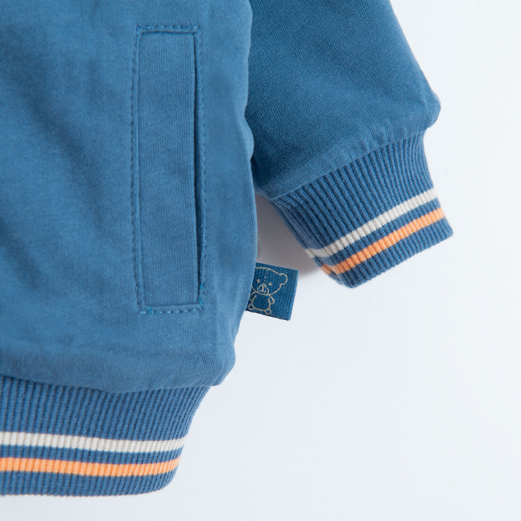 Blue and reversible ecru with dinosaurs print zip through sweatshirt