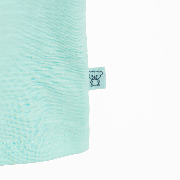 Light turquoise T-shirt with pirate print on the chest pocket